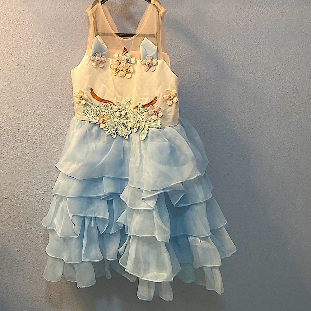 A blue and white unicorn dress